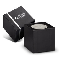 A compact grey speaker in a sleek black box with a logo on the packaging.