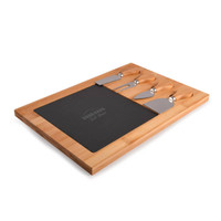 A bamboo cheese board with a slate centre and three stainless steel cheese knives, featuring a logo.