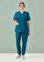 A women's teal V-neck scrub top paired with matching scrub pants, featuring a logo on the top.