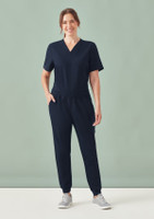 A pair of women's navy jogger scrub pants with an elastic waistband and side pockets, paired with a matching top.
