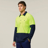 Man wearing a neon yellow and navy long-sleeve polo shirt.