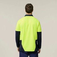 Man wearing high-visibility yellow work shirt with navy sleeves viewed from the back.