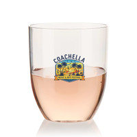A stemless shatterproof wine glass made of recycled Tritan™, featuring a logo and filled with pink liquid.