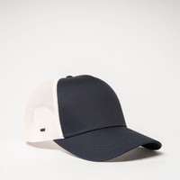 A navy and white UFlex Classic Ultra-lite 5 Panel Trucker Cap with a mesh back and a logo.
