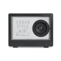 A black speaker featuring a front design with flowers and geometric shapes, including a prominent circular speaker.