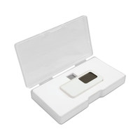 A white smartphone thermometer sits in an open white case, featuring a small digital display.