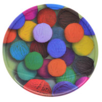 A round gel pad featuring vibrant coloured yarn balls arranged closely together, with a glossy finish.