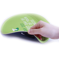 A round gel pad in vibrant green with a smooth surface, featuring a hand lifting one edge to reveal its texture.