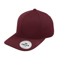 A maroon classic 6 panel cap with a rounded crown and a logo on the side.