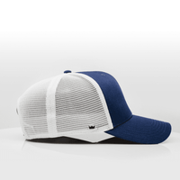 A navy blue trucker cap with a white mesh back and a curved brim, featuring a branding logo.