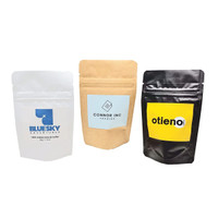 Three small stand-up pouches for espresso coffee in white, kraft brown, and black, each featuring a logo.
