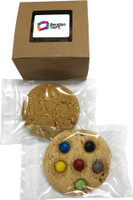A window box containing two cookie varieties, one plain and one with colourful chocolate buttons, both individually wrapped.