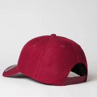 Red baseball cap with adjustable strap on plain background.
