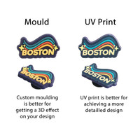 A set of decorative shoe charms featuring a rainbow design with the word "BOSTON" in various styles.