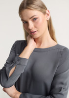 A grey women's Madison boatneck top with long sleeves and button detailing on the cuffs.