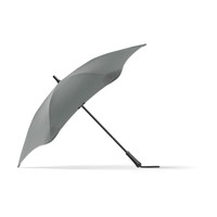 A grey BLUNT Classic Umbrella with a unique, aerodynamic shape and a curved canopy, featuring a logo on the handle.