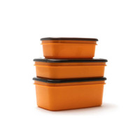 Stacked orange food storage containers with black lids.