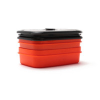 Stacked red and black food container on white background.
