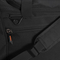 Close-up of black nylon bag with adjustable shoulder strap and zippered pocket.