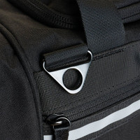 Close-up of a black duffel bag showcasing durable stitching and metal hardware.