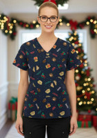 A navy women's scrub top with festive Christmas patterns, featuring various holiday-themed items and a logo.