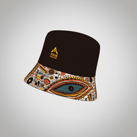 A reversible bucket hat featuring a brown top and a multicoloured patterned brim, with a logo on the front.