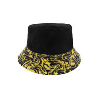 A reversible black and yellow bucket hat featuring a wavy pattern on the brim and a solid black top.