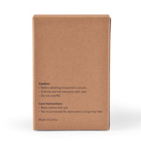 A brown cardboard box featuring care instructions and caution details for a reusable coffee cup.