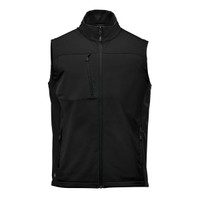 A black softshell vest with a high collar, zippered front, and multiple pockets. Features a logo on the garment.