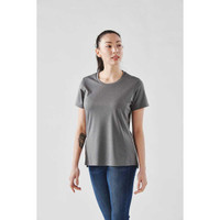 A woman wearing a grey short sleeve performance tee, featuring a rounded neckline and a slightly relaxed fit.