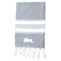 A 100% cotton Turkish towel in grey with white stripes and fringed edges, featuring a rabbit logo.