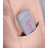 A bamboo fibre cutlery set in a grey case, resting inside a pocket of a pink bag.