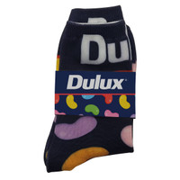 Magic Seamless Socks featuring a navy background with colourful patterns. The product includes a branded band.