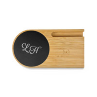 A bamboo cup warmer with an inductive charger, featuring a black circular charging area and a logo.