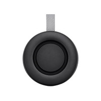 A black portable speaker with a grey strap, featuring a circular design and textured surface.