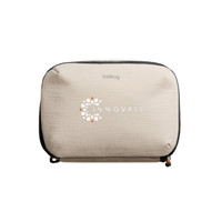 A light beige tech kit with a zip closure and a logo on the front. Ideal for organising small technology items.