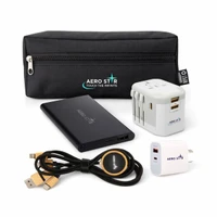 A black zippered pouch containing a portable charger, universal power adaptor, USB cable, and wireless charging pad.