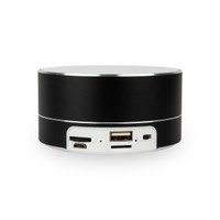 A black cylindrical speaker with USB and AUX ports on the side. It has a sleek, modern design.