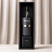 A black wine bottle cooler, a glass tumbler, and a box of brittle, all packaged in a stylish gift box.