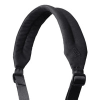 A padded black shoulder strap with an adjustable buckle and a logo at the top.