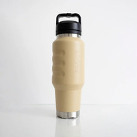 Front view of a beige insulated 1L water bottle featuring ergonomic finger-grip contours, a stainless steel base, and an integrated carry-handle lid.