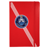 A red journal with a textured cover and an emblem in the centre, featuring stripes and a logo.