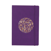 A purple bound journal featuring a decorative circular design and an elastic band closure.