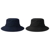Two recycled surf hats are displayed, one in navy blue and the other in black, both with wide brims and a logo.