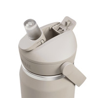 A drink bottle in a beige colour features a flip straw lid and a side lever for easy opening. It has a logo.