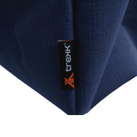 A close-up of a navy blue waterproof beach bag, featuring a small branded tab.