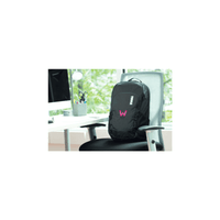 A black laptop backpack with a logo, positioned on a chair beside a desk with a computer and stationary.