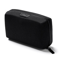 A black tech kit with a rectangular shape, featuring a textured surface and a zipper closure. It has a branding logo.
