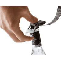 A drink bottle is being secured with a grey strap and clip, designed for use with the Bellroy Lite Cooler Caddy 10L.