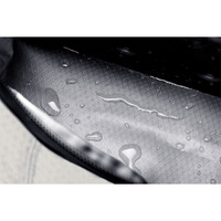 A cooler bag featuring a textured interior with water droplets, showcasing its waterproof design. It has a logo.